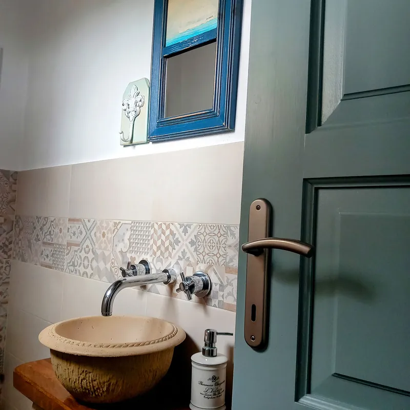 A basin under a blue-framed window