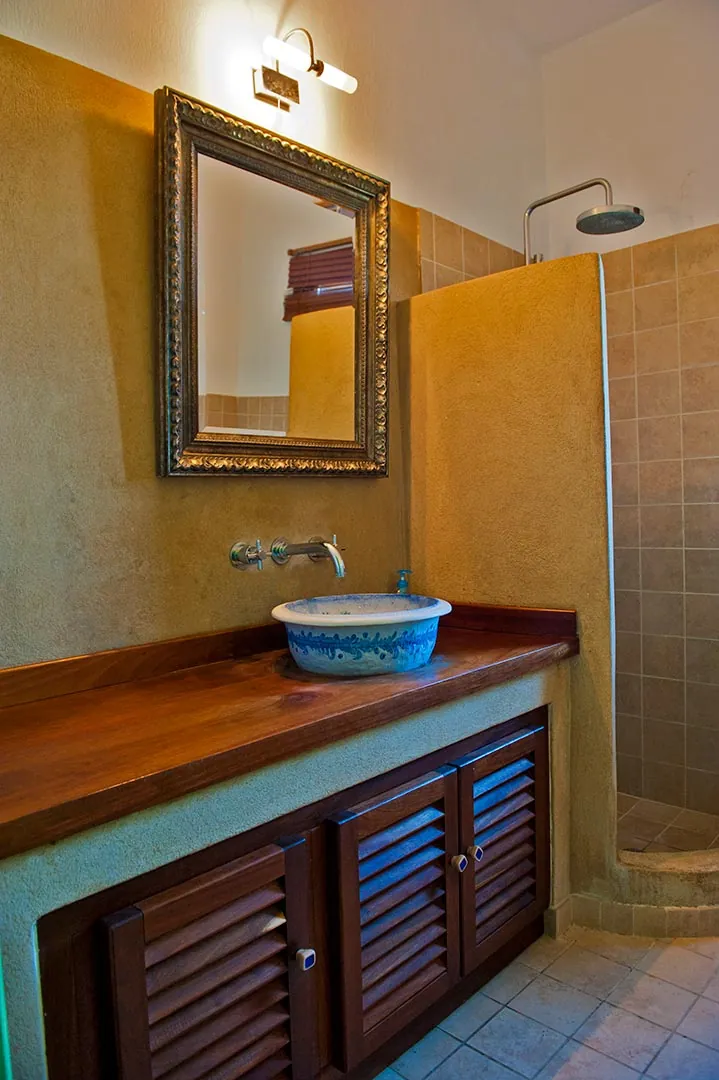 A bathroom vanity with a mirror