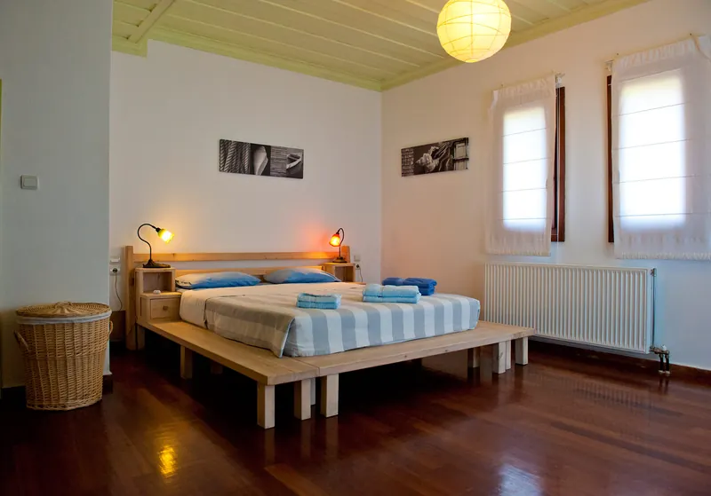 A bedroom with a green door