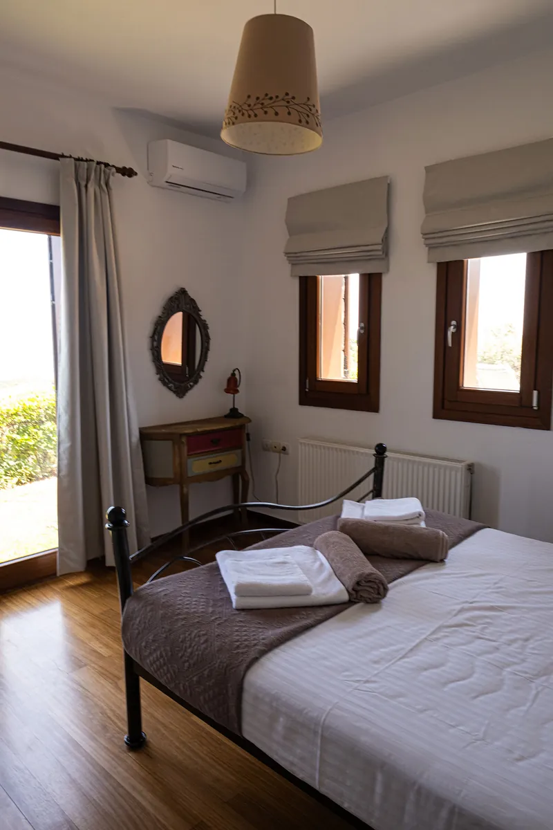 A double bedroom with balcony doors