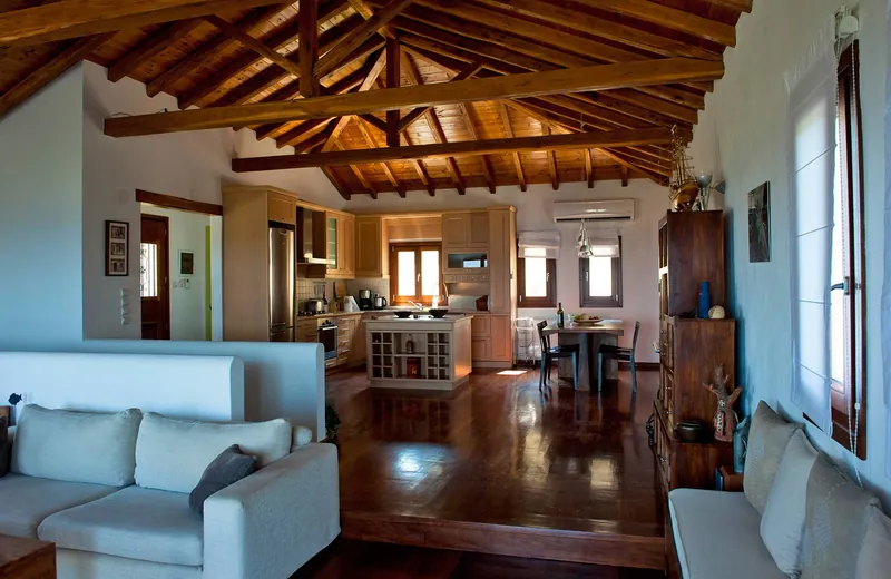 The living room, dining table and kitchen