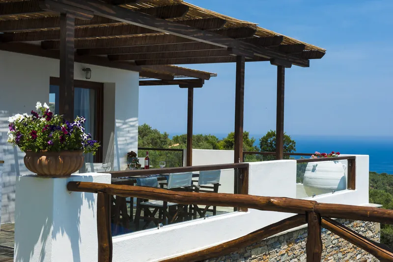 The pergola and pots of flowers on the terrace