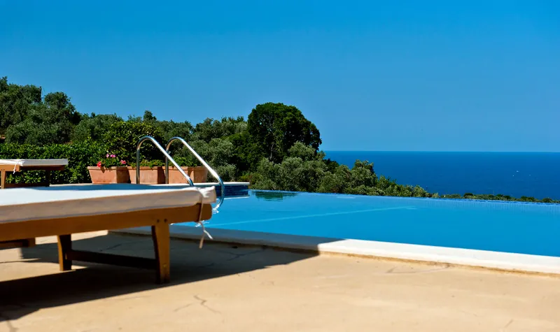 The pool’s edge meeting the sea view