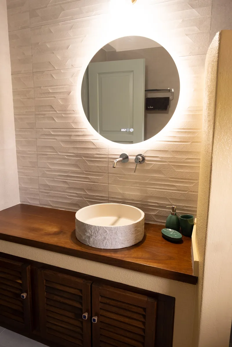 The stone basin on a wooden vanity