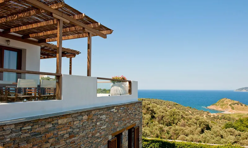 The stone terrace above the green valley and the sea